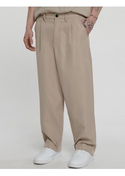 Cropp - Beżowe spodnie loose ADU.LTD - Beżowy Cropp Cropp - kod rabatowy