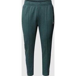 Spodnie damskie zielone Adidas Originals Plus casual  - zdjęcie produktu