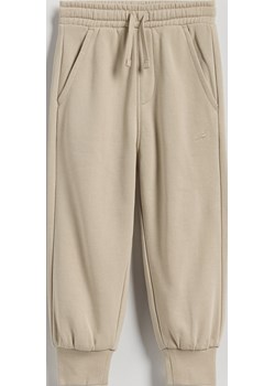 Reserved - Bawełniane spodnie jogger - kremowy Reserved Reserved - kod rabatowy