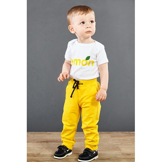 Dziecięce spodnie dresowe żółte żółty Garna Mama Sp. Z O.o. 116 promocyjna cena Astratex