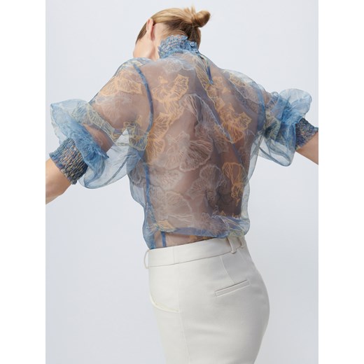 Bluzka damska Reserved w abstrakcyjne wzory niebieska z długimi rękawami 