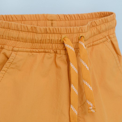 Cool Club spodnie chłopięce pomarańczowe 