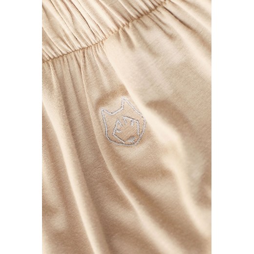 LA026 Spodnie z rozcięciami na nogawkach - cappuccino Lalupa XL (42) Świat Bielizny
