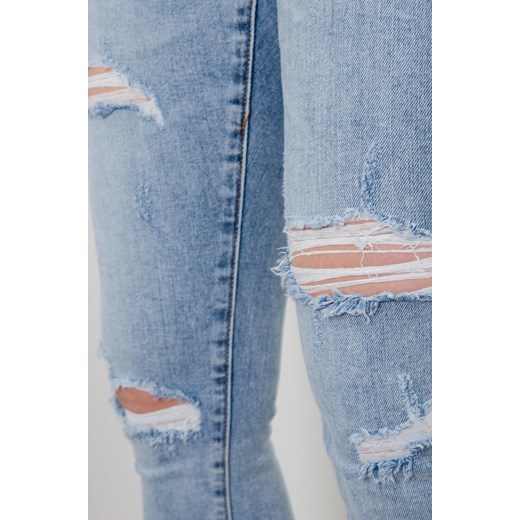 JASNE SPODNIE JEANSOWE Z PRZETARCIAMI PLUS SIZE ( L-4XL ) Olika 4XL olika.com.pl