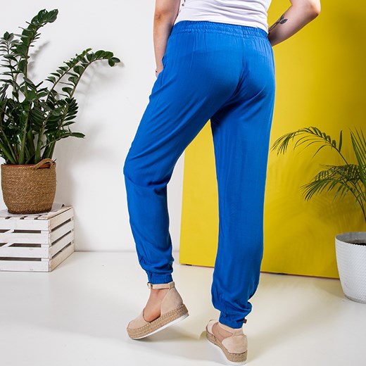 Niebieskie damskie materiałowe spodnie PLUS SIZE - Odzież Royalfashion.pl 4XL/5XL royalfashion.pl