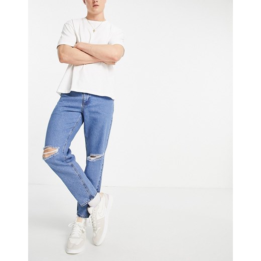 ASOS DESIGN – Klasyczne sztywne jeansy z przetarciami na kolanach w odcieniu spranego błękitu-Niebieski W34 L30 Asos Poland