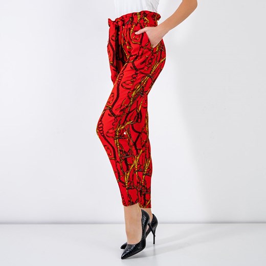 Czerwone damskie spodnie z printem - Odzież Royalfashion.pl M/L - 39 royalfashion.pl