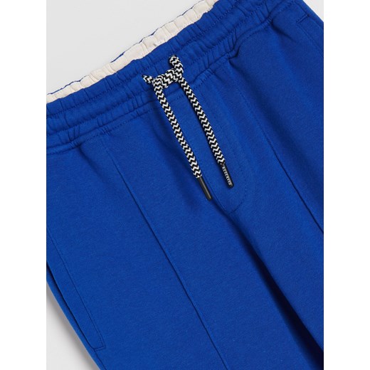 Reserved - Dresowe spodnie z kieszeniami - Niebieski Reserved 152 Reserved