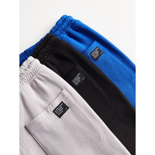 Reserved - Dresowe spodnie z kieszeniami - Niebieski Reserved 152 Reserved