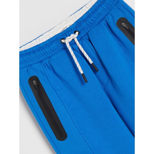 Reserved - Dresowe spodnie z kieszeniami - Niebieski Reserved 146 Reserved