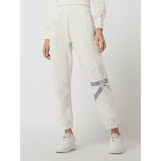 Spodnie damskie białe Calvin Klein na wiosnę bawełniane 