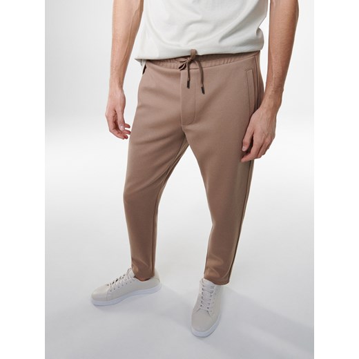 Reserved - Spodnie slim z elastyczną talią - Beżowy Reserved XL Reserved