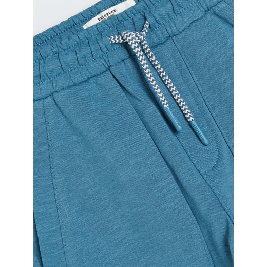 Reserved - Spodnie dresowe z naszywką - Niebieski Reserved 128 Reserved