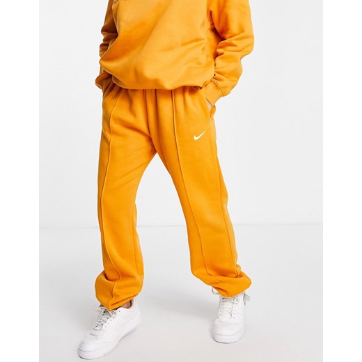 Nike – Pomarańczowe joggersy oversize z małym logo Swoosh-Żółty Nike XL Asos Poland