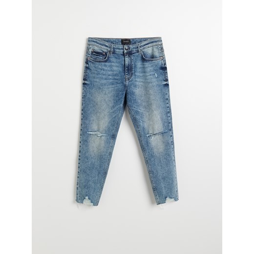 Reserved - Spodnie jeansowe z przetarciami - Niebieski Reserved 32 okazja Reserved