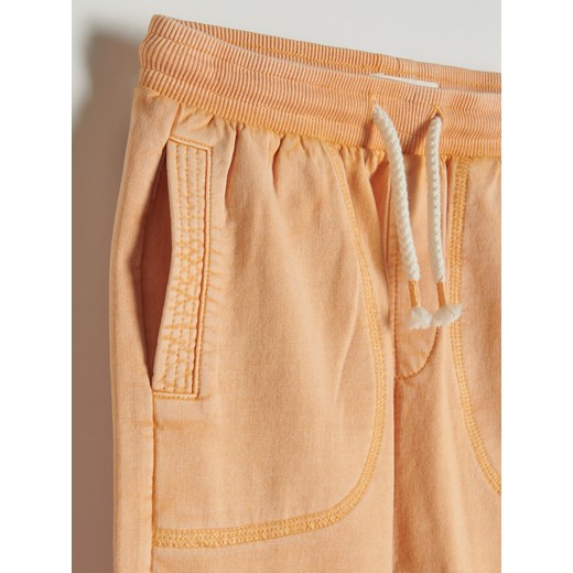 Reserved - Bawełniane spodnie z kieszeniami - Pomarańczowy Reserved 110 Reserved