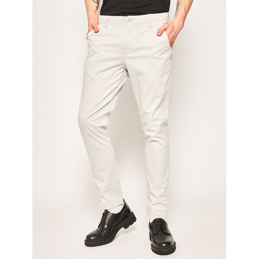 Calvin Klein Jeans Spodnie materiałowe J30J315314 Szary Slim Fit 33_32 MODIVO promocja