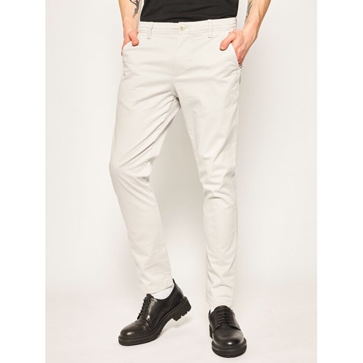 Calvin Klein Jeans Spodnie materiałowe J30J315314 Szary Slim Fit 33_32 MODIVO promocja