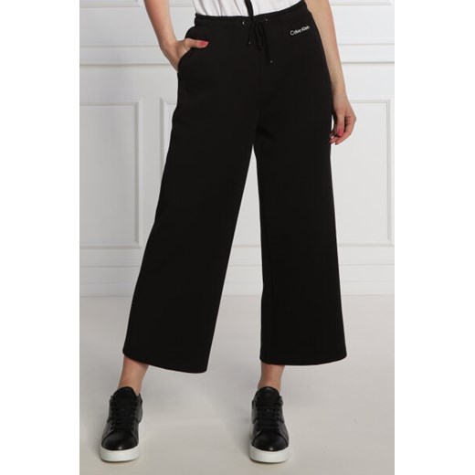Calvin Klein Spodnie dresowe | flare fit Calvin Klein L Gomez Fashion Store
