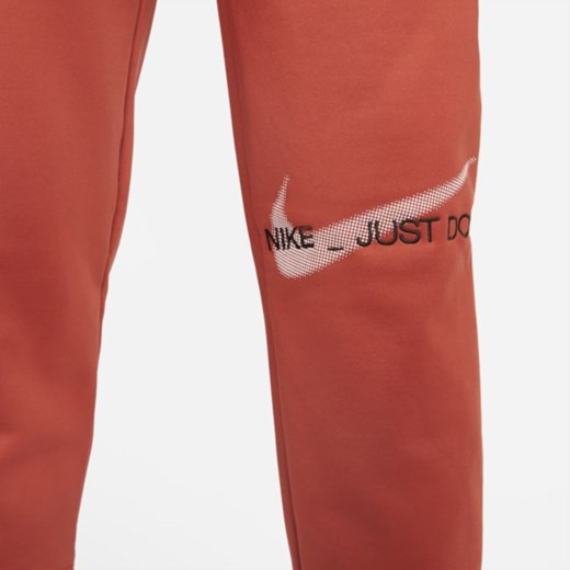 Damskie spodnie treningowe z nadrukiem Nike Therma-FIT All Time - Czerwony Nike XS Nike poland
