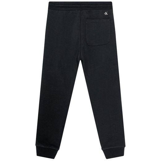 Calvin Klein Jeans Spodnie dresowe Stretch Slim IB0IB00674 Czarny Regular Fit 12Y okazyjna cena MODIVO