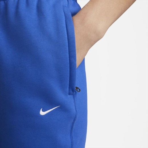 Damskie spodnie z dzianiny Nike Solo Swoosh - Niebieski Nike XS Nike poland