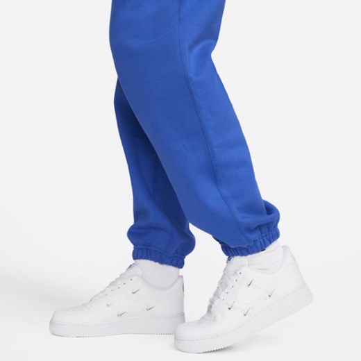 Damskie spodnie z dzianiny Nike Solo Swoosh - Niebieski Nike M Nike poland