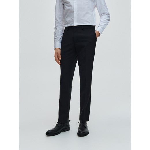 Reserved - Spodnie slim fit - Czarny Reserved 56 Reserved
