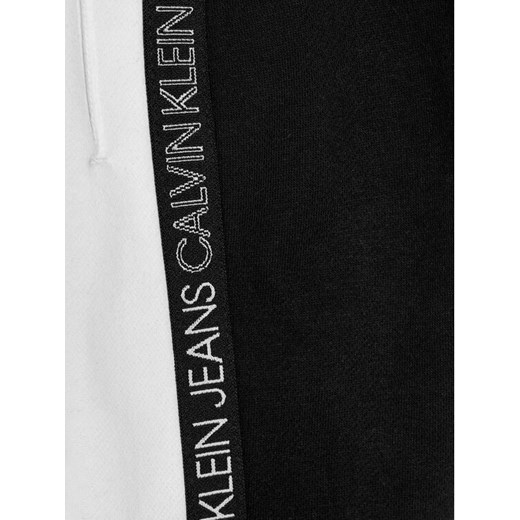 Calvin Klein Jeans Spodnie dresowe Colour Block IB0IB00866 Czarny Regular Fit 10Y wyprzedaż MODIVO