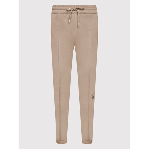 Calvin Klein Jeans Spodnie dresowe J20J216240 Beżowy Regular Fit L MODIVO wyprzedaż