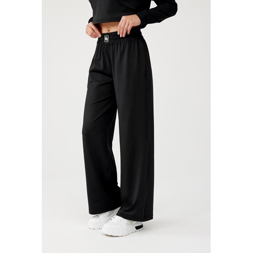 Damskie spodnie dresowe OLIMP LOOSE PANTS : Kolor - Czarny, Rozmiar - M Rough Radical M ROUGH RADICAL