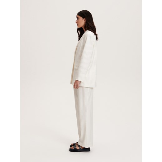 Spodnie damskie białe Reserved z tkaniny 