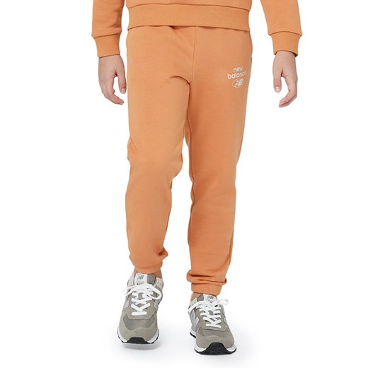 Spodnie New Balance YP31508SEI - pomarańczowe ze sklepu streetstyle24.pl w kategorii Spodnie chłopięce - zdjęcie 157623188