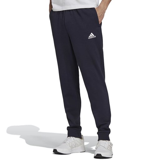 Spodnie dresowe adidas Essentials Fleece Regular Fit Tapered Cuff H33664 - granatowe ze sklepu streetstyle24.pl w kategorii Spodnie męskie - zdjęcie 157623196