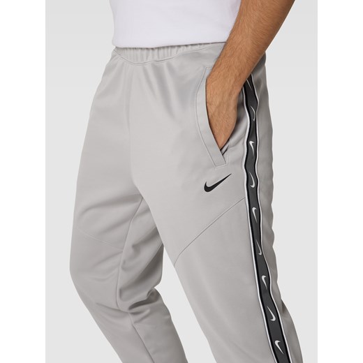 Spodnie dresowe z lampasami Nike M Peek&Cloppenburg