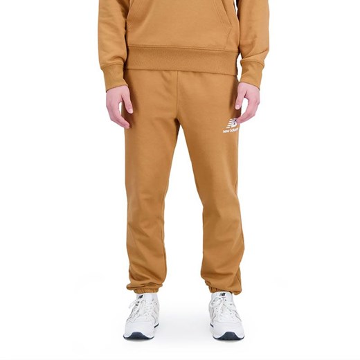 Spodnie New Balance MP31539TOB - brązowe ze sklepu streetstyle24.pl w kategorii Spodnie męskie - zdjęcie 160422449