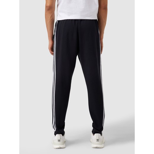 Spodnie dresowe z paskami z logo Adidas Sportswear XS Peek&Cloppenburg 