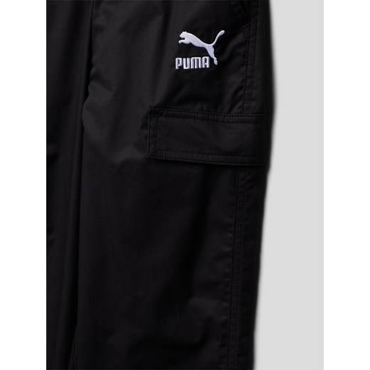 Spodnie dresowe z kieszeniami z patką model ‘CLASSICS Woven Pants’ Puma 140 Peek&Cloppenburg 