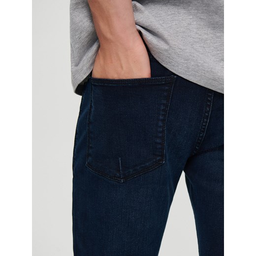 Ciemnogranatowe spodnie jeansowe slim fit - Niebieski House 30/30 House