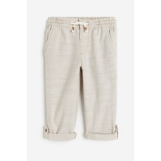 H & M - Podwijane spodnie Loose Fit - Beżowy H & M 140 (9-10Y) H&M