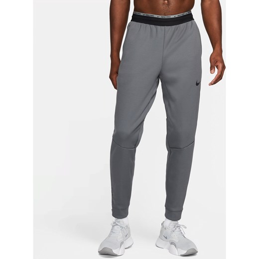 Męskie spodnie do fitnessu Nike Therma-FIT Therma Sphere - Szary ze sklepu Nike poland w kategorii Spodnie męskie - zdjęcie 161525918