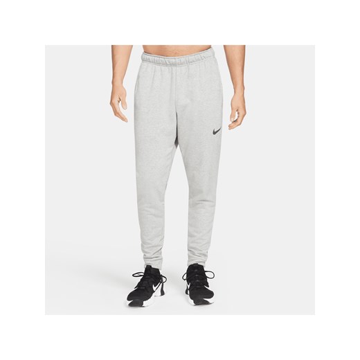 Męskie zwężane spodnie do fitnessu z dzianiny Dri-FIT Nike Dry - Szary ze sklepu Nike poland w kategorii Spodnie męskie - zdjęcie 161526168