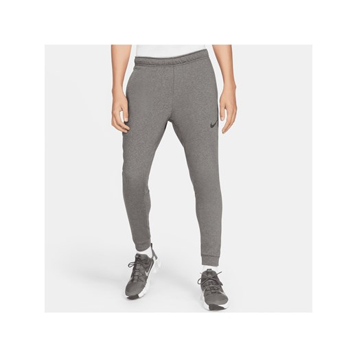 Męskie zwężane spodnie do fitnessu z dzianiny Dri-FIT Nike Dry - Szary ze sklepu Nike poland w kategorii Spodnie męskie - zdjęcie 161526517