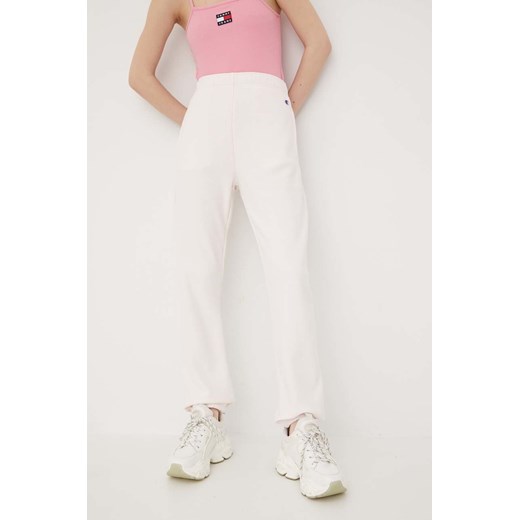 Champion spodnie dresowe 115098 damskie kolor różowy gładkie 115098-EM004 ze sklepu PRM w kategorii Spodnie damskie - zdjęcie 162004308