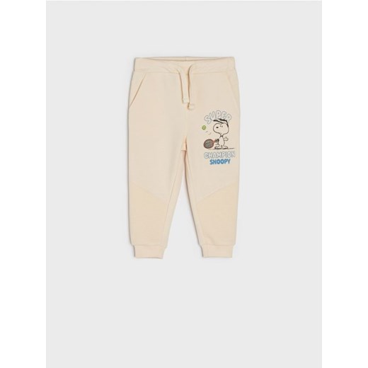 Sinsay - Spodnie dresowe jogger Snoopy - kremowy Sinsay 80 Sinsay