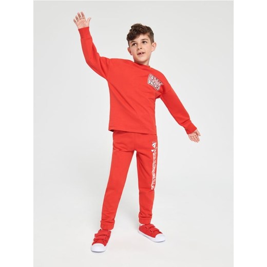 Sinsay - Spodnie dresowe jogger Psi Patrol - czerwony ze sklepu Sinsay w kategorii Spodnie chłopięce - zdjęcie 162268468