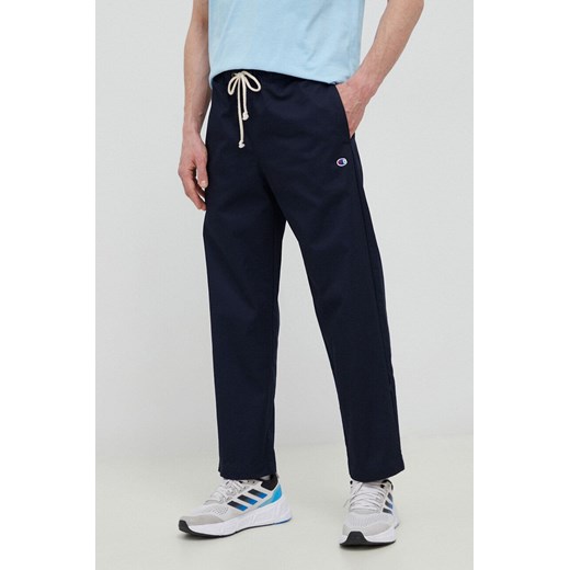 Champion spodnie męskie kolor granatowy proste 216544-TTP ze sklepu PRM w kategorii Spodnie męskie - zdjęcie 162380635