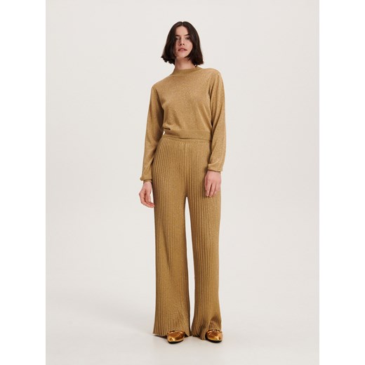 Reserved - Spodnie z połyskującej dzianiny - złoty Reserved L Reserved