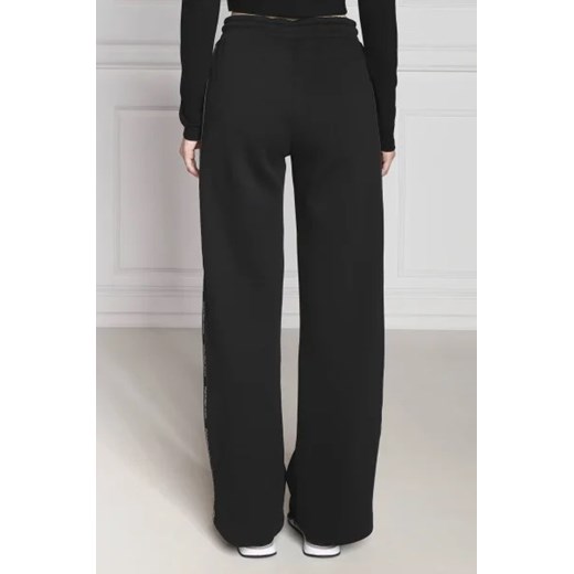 CALVIN KLEIN JEANS Spodnie dresowe LOGO PIPING | flare fit M promocja Gomez Fashion Store