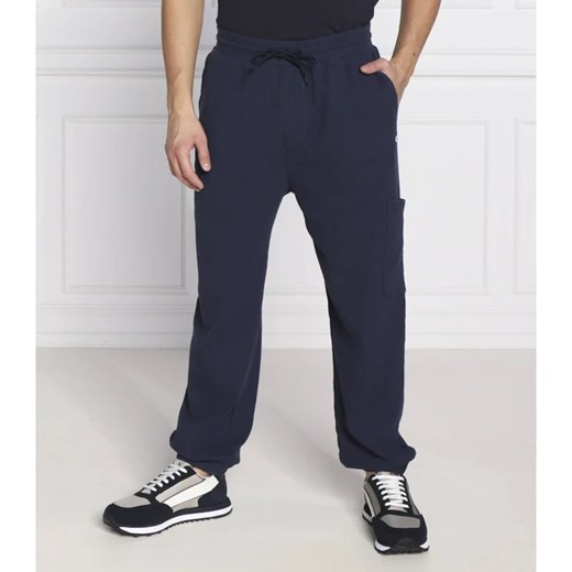 Tommy Jeans Spodnie dresowe TJM BAX | Regular Fit ze sklepu Gomez Fashion Store w kategorii Spodnie męskie - zdjęcie 164328538